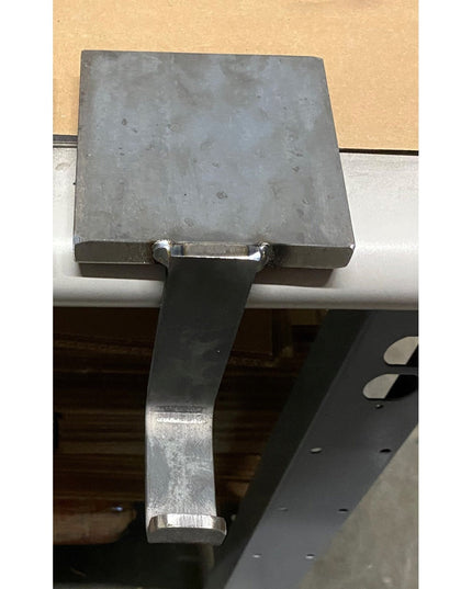 Industrial Farm Co Annie Stocking Holder in gray metal with flat square top and curved hook arm mounted on white surface