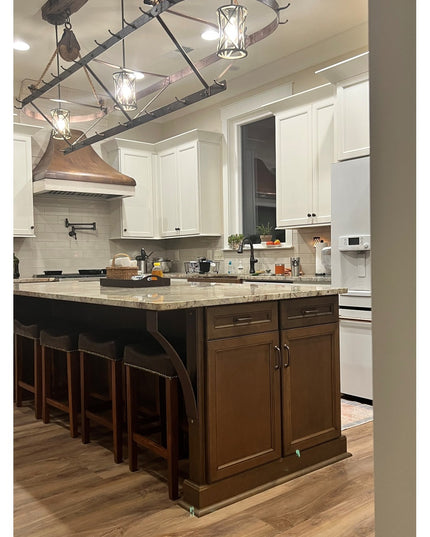 Industrial Farm Co Rochester black metal countertop support brackets holding granite island top in rustic farmhouse kitche...