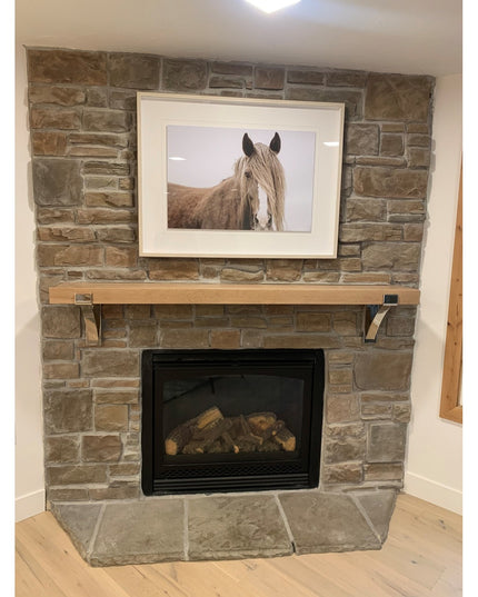 Kudlick Farmhouse Mantel Bracket by Industrial Farm Co supporting wooden mantel shelf on stone fireplace with metal corbel...