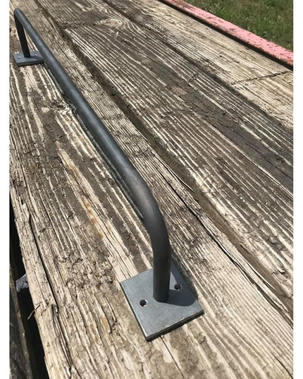 Industrial Farm Co Split Rock Towel Rack in black metal with square mounting plate on weathered wood deck surface
