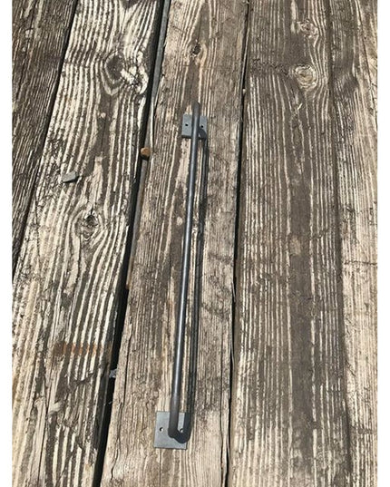 Industrial Farm Co Split Rock Towel Rack in dark metal finish mounted on weathered gray wood planks showing rustic farmhou...