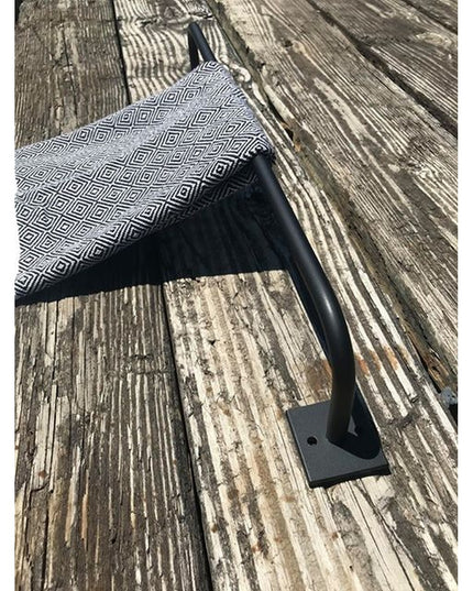 Black metal Split Rock Towel Rack by Industrial Farm Co mounted on weathered wood wall with geometric patterned towel