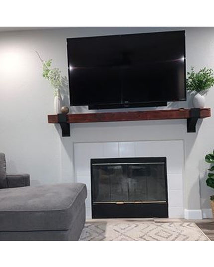 Norfolk Farmhouse Bracket by Industrial Farm Co supporting rustic wood mantel shelf above white fireplace with mounted TV