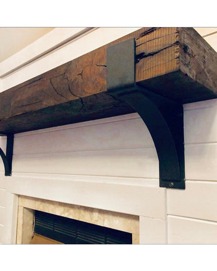 Kudlick Farmhouse Mantel Bracket in black metal supporting rustic wood beam above white fireplace mantel by Industrial Far...