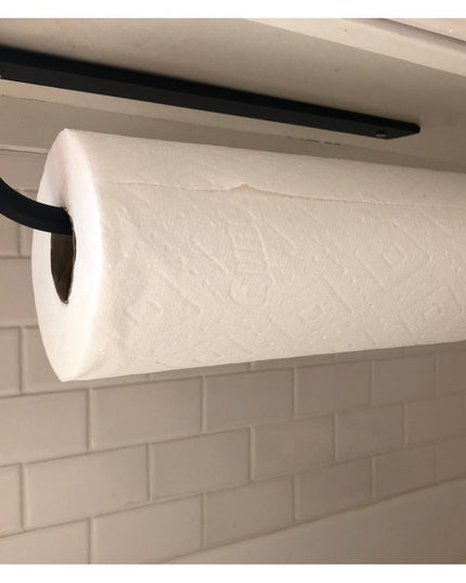 Black metal under-cabinet paper towel holder from Industrial Farm Co mounted beneath white cabinet with white paper towel ...