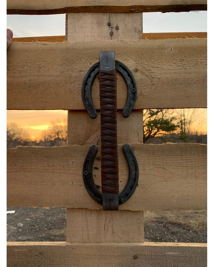 Bermuda Horseshoe Door Handle with brown leather wrap mounted on wooden fence post by Industrial Farm Co, handmade rustic ...