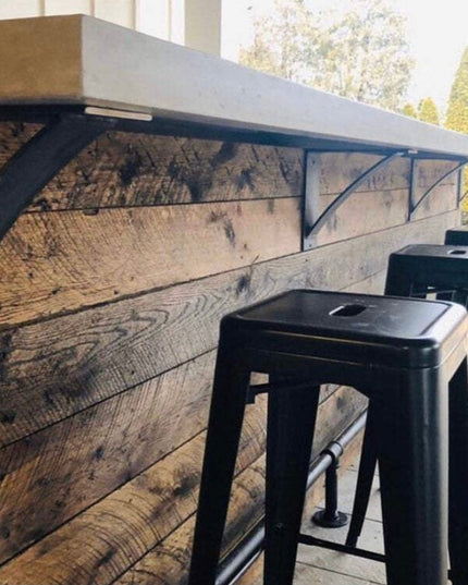 Black industrial steel shelf brackets supporting reclaimed wood counter with metal bar stools - Albany 4 inch curved suppo...