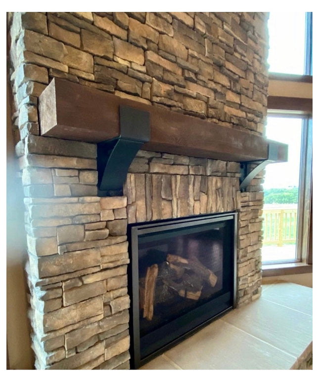 Rustic stone fireplace featuring The Otisco Farmhouse Style Bracket by Industrial Farm Co supporting wooden mantel beam