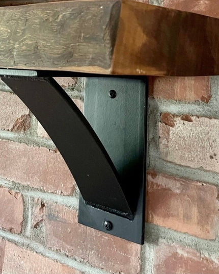 Black steel Albany 4 inch industrial shelf bracket with curved support bar mounted on brick wall supporting reclaimed wood...