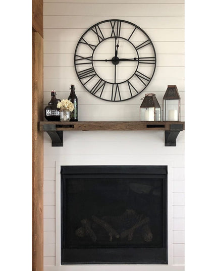 Rustic wood Norfolk Farmhouse Brackets by Industrial Farm Co supporting wooden mantel shelf above black fireplace with whi...