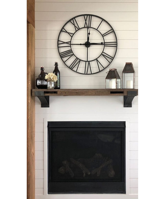 Rustic wood Norfolk Farmhouse Brackets by Industrial Farm Co supporting wooden mantel shelf above black fireplace with whi...