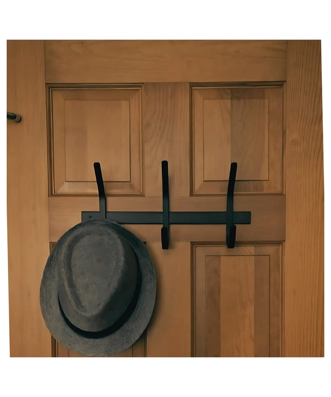 Industrial Farm Co Meredith Petite Double J black metal coat rack mounted on natural wood door with gray hat hanging