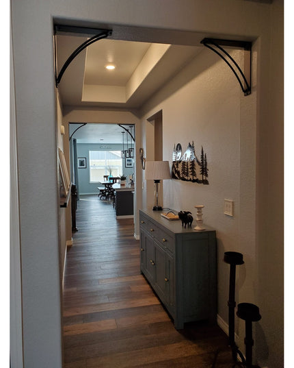 Black metal Sawmiller Shelf Brackets from Industrial Farm Co supporting wooden shelf in modern hallway entryway