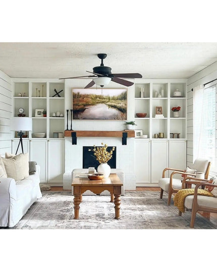 Kudlick Farmhouse Mantel Bracket by Industrial Farm Co in natural wood with black metal supports holding rustic wooden man...