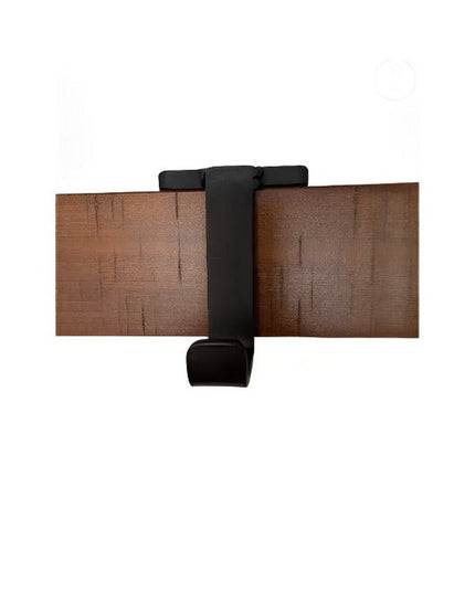 Industrial Farm Co Annie Stocking Holder in black metal with wood grain design, wall-mounted Christmas stocking hanger wit...