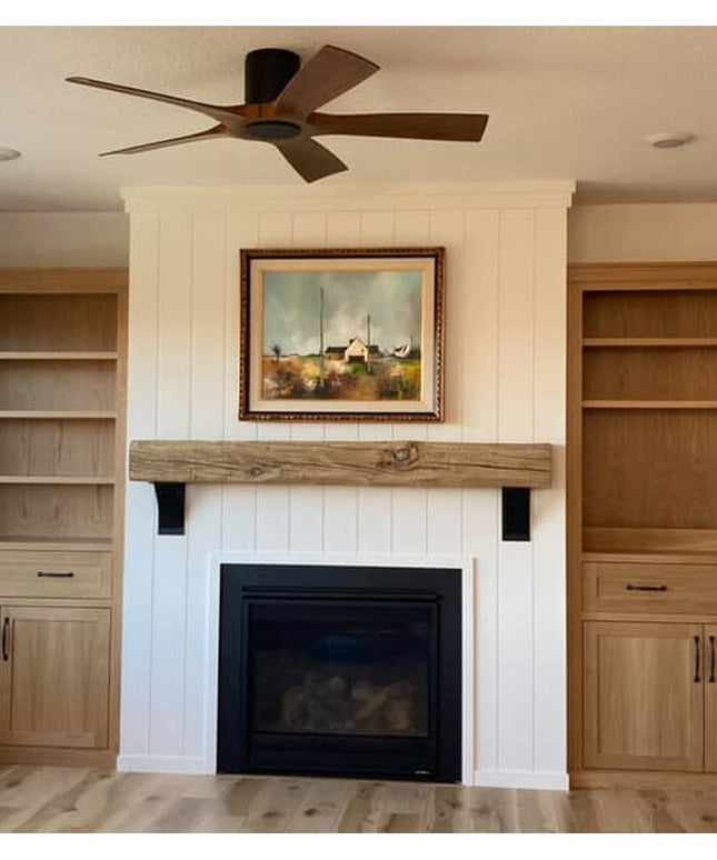 Heavy duty steel Ninemile 5" industrial shelf brackets supporting wooden mantel above fireplace with built-in cabinets by ...