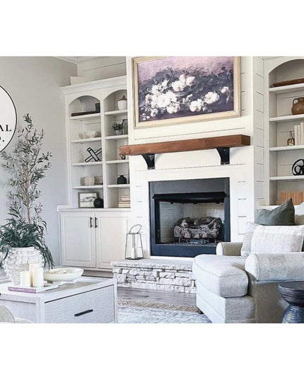 Industrial Farm Co Albany 4-inch black steel shelf brackets supporting wooden mantel above fireplace in white built-in ent...