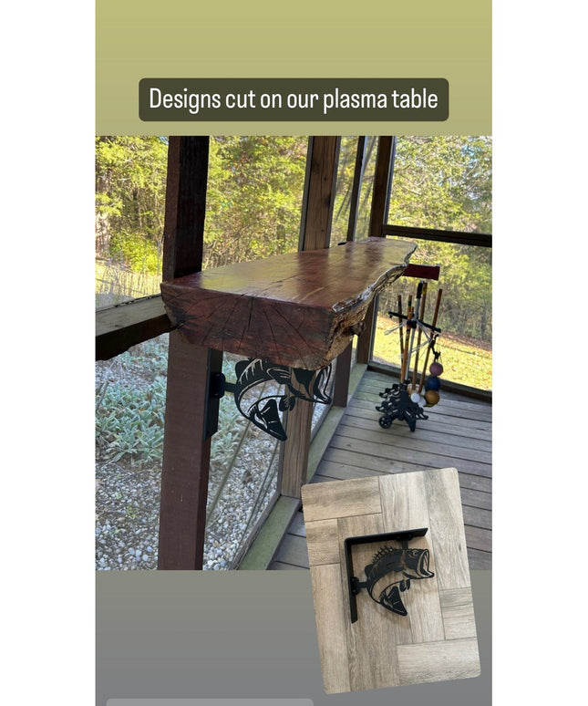 Black metal fish-shaped shelf brackets cut with plasma table, displayed on rustic wooden shelves in outdoor cabin setting ...