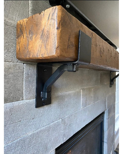 Heavy duty black steel Buffalo mantel bracket with square support bar holding reclaimed wood beam on stone fireplace surro...