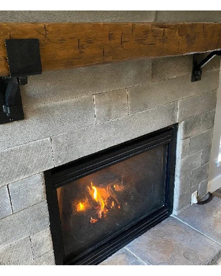 Heavy duty black steel mantel brackets supporting rustic wood beam above stone fireplace, The Buffalo 4" Square Support Ba...