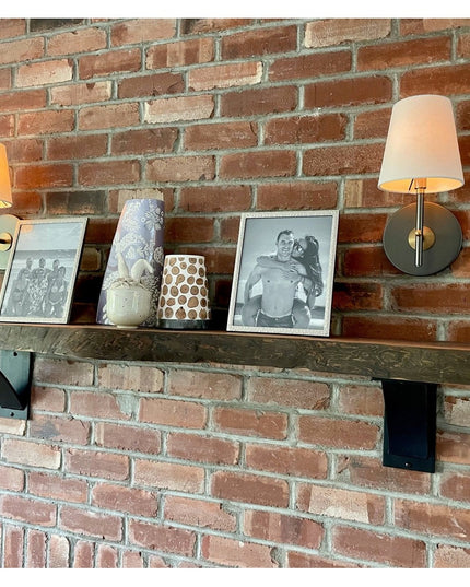 Industrial Farm Co Albany black steel shelf brackets supporting rustic wood floating shelf on exposed brick wall with deco...
