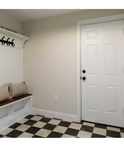 The Christopher Double Hook Coat Rack by Industrial Farm Co mounted on white mudroom wall with built-in bench and checkere...