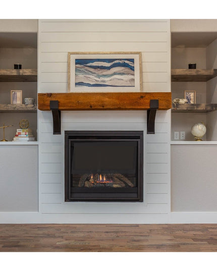 Kudlick Farmhouse black metal mantel brackets supporting reclaimed wood beam above white shiplap fireplace surround by Ind...