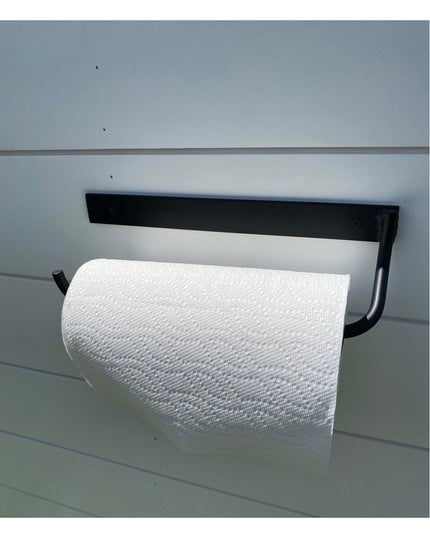 Black metal Hyde Hall Paper Towel Holder by Industrial Farm Co mounted under cabinet with white paper towel roll