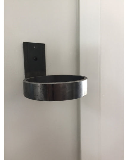Black metal Hudson Wall Planter Ring by Industrial Farm Co mounted on white wall corner, featuring sleek cylindrical desig...