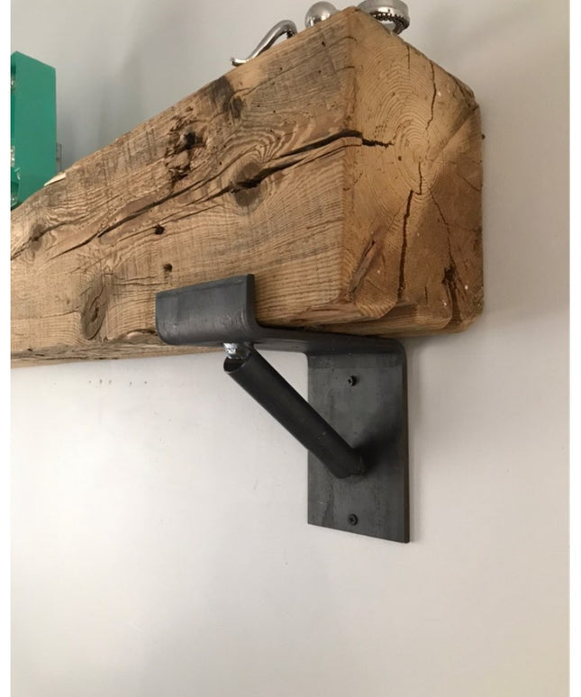 Rustic reclaimed wood beam floating shelf mounted on black metal bracket support from Industrial Farm Co, showing natural ...