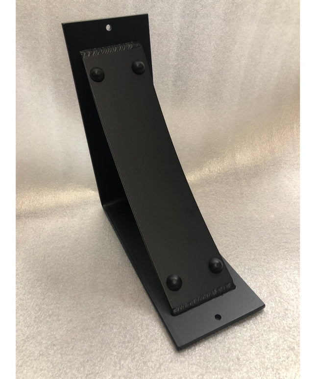 Black metal Utica Support bracket by Industrial Farm Co with curved L-shape design and riveted details on neutral background