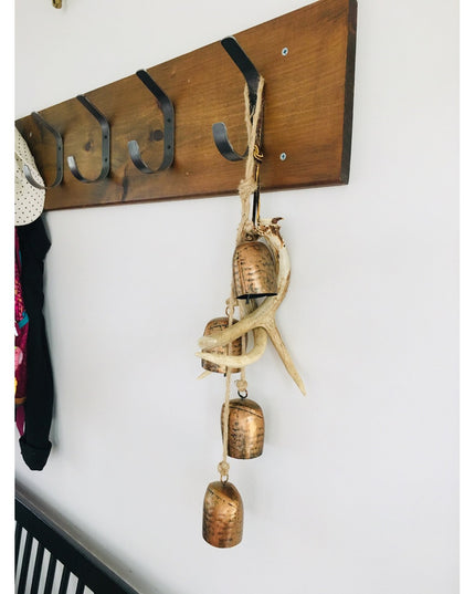 Industrial Farm Co Henrietta 1 inch wide double hook in dark metal finish mounted on wooden board with rustic bell decorat...