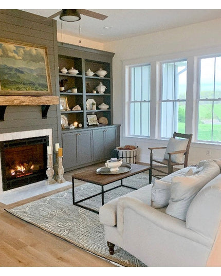 Modern farmhouse living room featuring black steel Industrial Farm Co Albany 4" shelf brackets supporting built-in shelvin...