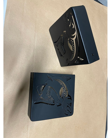 Black metal Vandiver Trout Mantel End Caps by Industrial Farm Co featuring detailed fish design cutouts on wooden surface