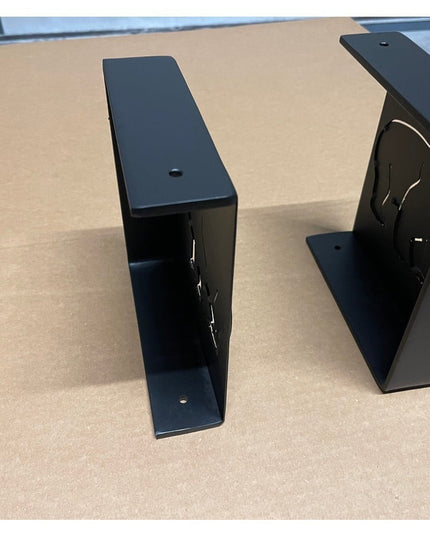 Black metal Vandiver Evergreen Tree Mantel End Caps by Industrial Farm Co showing angular geometric design on wood surface