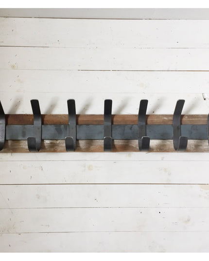 The Christopher Double Hook Coat Rack by Industrial Farm Co featuring seven black metal hooks mounted on gray metal rail a...