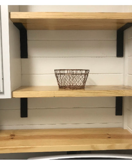 Black metal Lucas L Bracket shelf supports holding natural wood shelves with wire baskets in white shiplap pantry from Ind...