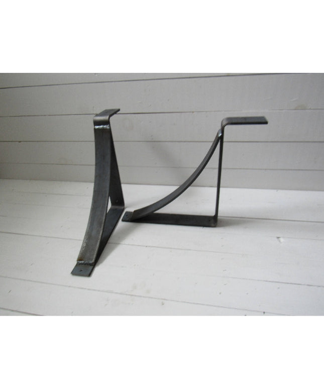 Black metal Marietta shelf bracket corbels by Industrial Farm Co with curved support design on white wood background