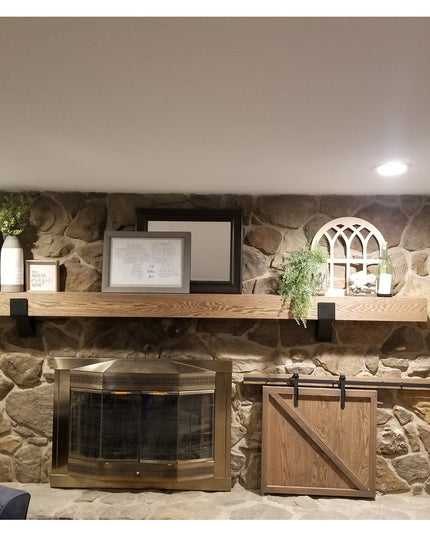 Natural wood Norfolk Farmhouse Brackets by Industrial Farm Co supporting rustic oak mantel shelf above stone fireplace in ...