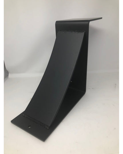 Black metal Norfolk Farmhouse Bracket by Industrial Farm Co, curved L-shaped corbel with welded seams against white backgr...