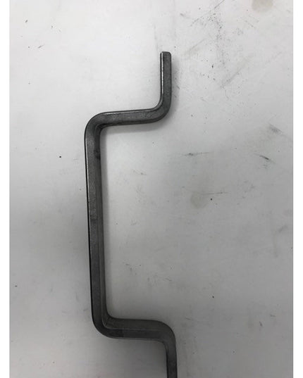 Black wrought iron Onondaga Handle door pull with curved design by Industrial Farm Co on white marble surface