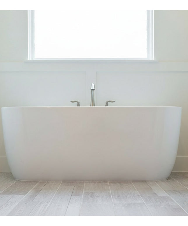 Oswego Modern Bathroom Towel Bar by Industrial Farm Co mounted on white bathroom wall above freestanding white bathtub