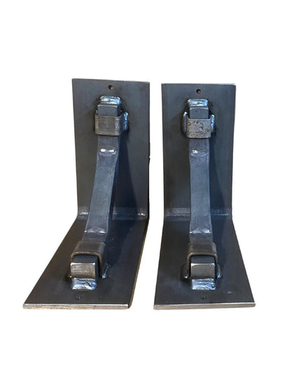 Two black welded steel Rosamond Shelf Supports by Industrial Farm Co with L-shaped brackets and bolt hardware for wall mou...