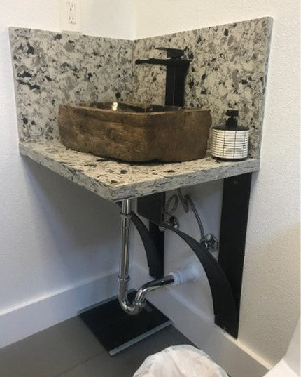 Black metal Endicott Breakfast Bar Support bracket holding granite corner sink vanity with vessel bowl and modern faucet