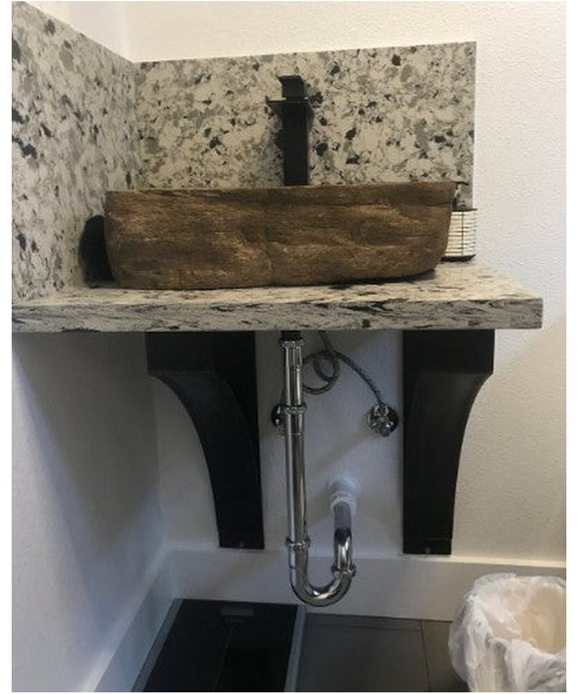 Rustic wooden vessel sink basin with natural stone backsplash and black metal bracket supports from Industrial Farm Co