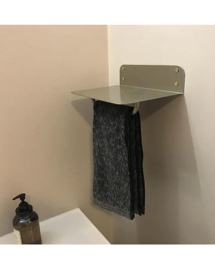 Houston Metal Wall Shelf by Industrial Farm Co in sage green with brass rivets mounted on bathroom wall holding dark gray ...