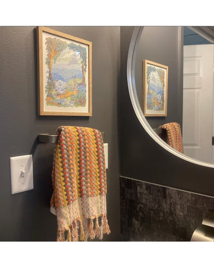 Emma Towel Holder by Industrial Farm Co - sleek metal door handle with decorative autumn-colored crocheted towel draped ov...