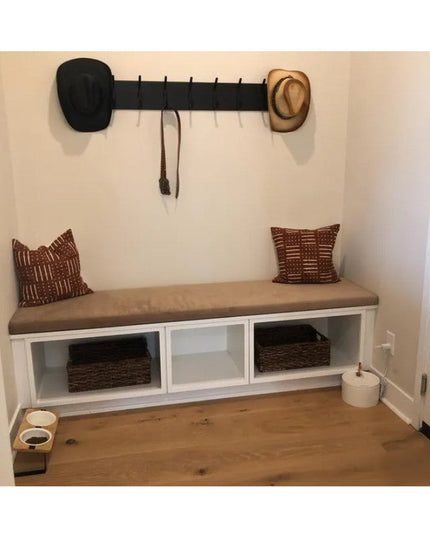 Black metal wall-mounted Bo Style Lodge Coat Rack by Industrial Farm Co with multiple hooks, displayed above white storage...