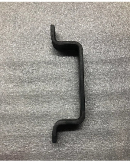 Black metal Sagamore Hill Pull door handle with curved S-shape design by Industrial Farm Co on textured surface