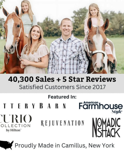 Family with two horses in a field,